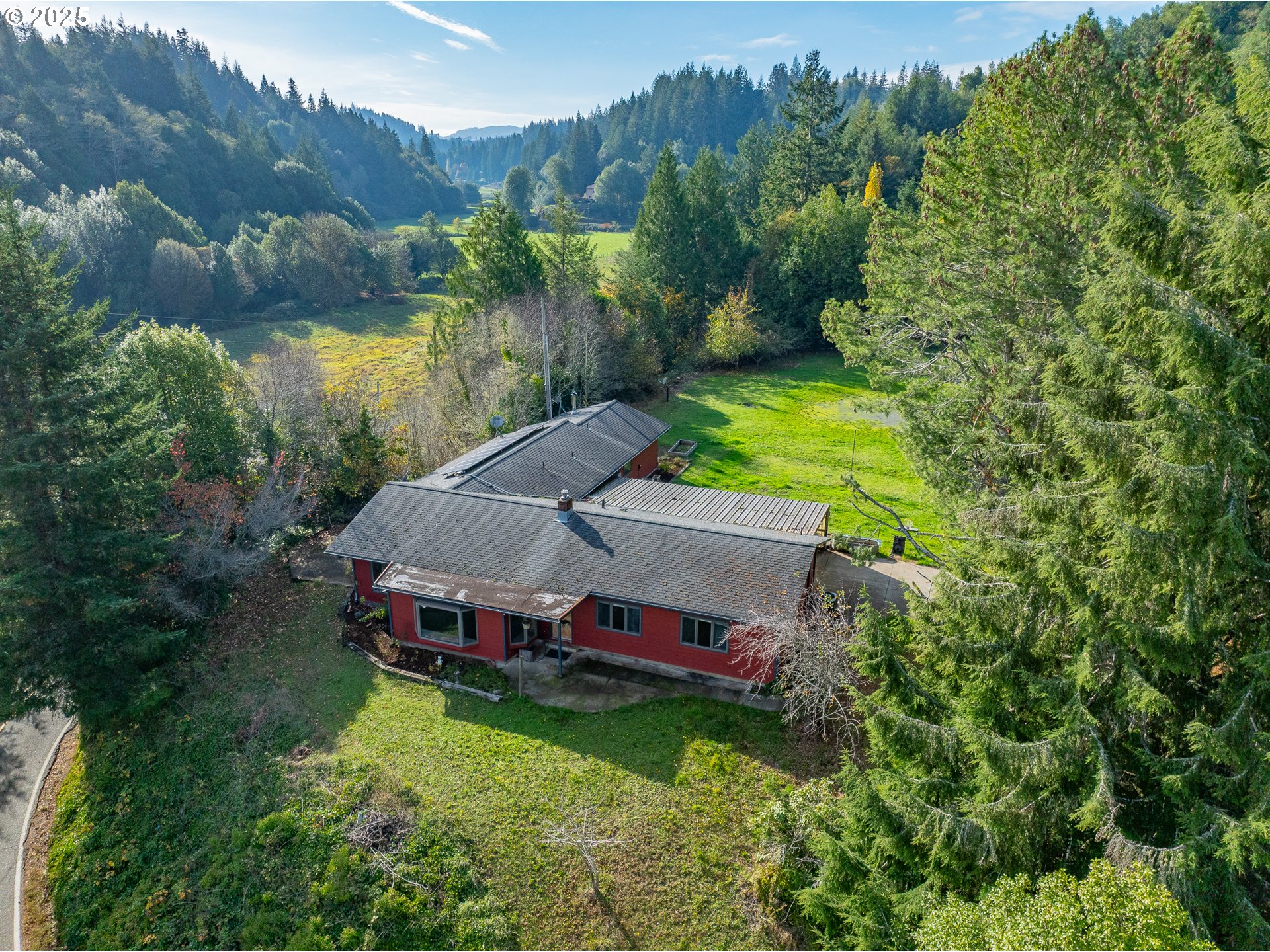 53874 Fishtrap Road Myrtle Point, OR 97458 - Photo 1 of 48 an aerial view of a house with a yard