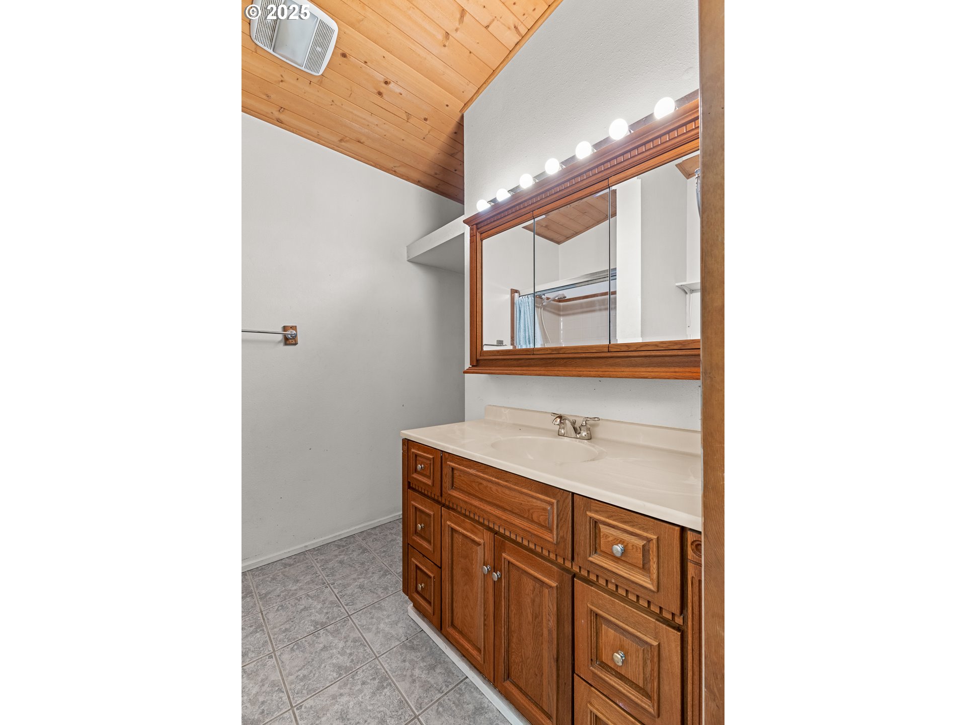 53874 Fishtrap Road Myrtle Point, OR 97458 - Photo 32 of 48 a bathroom with a sink and a mirror