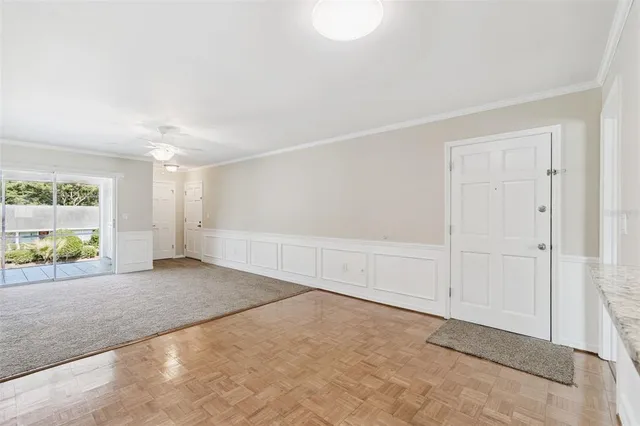 a view of an empty room with a window