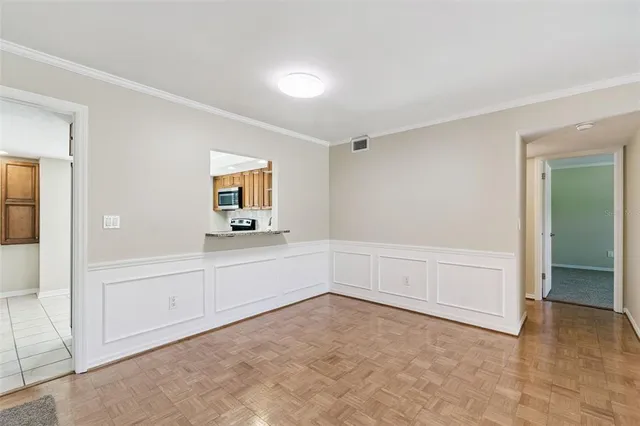 a kitchen with stainless steel appliances granite countertop a refrigerator a stove a sink and a microwave