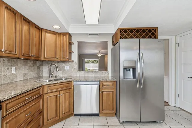 a kitchen with a stove a sink and a microwave