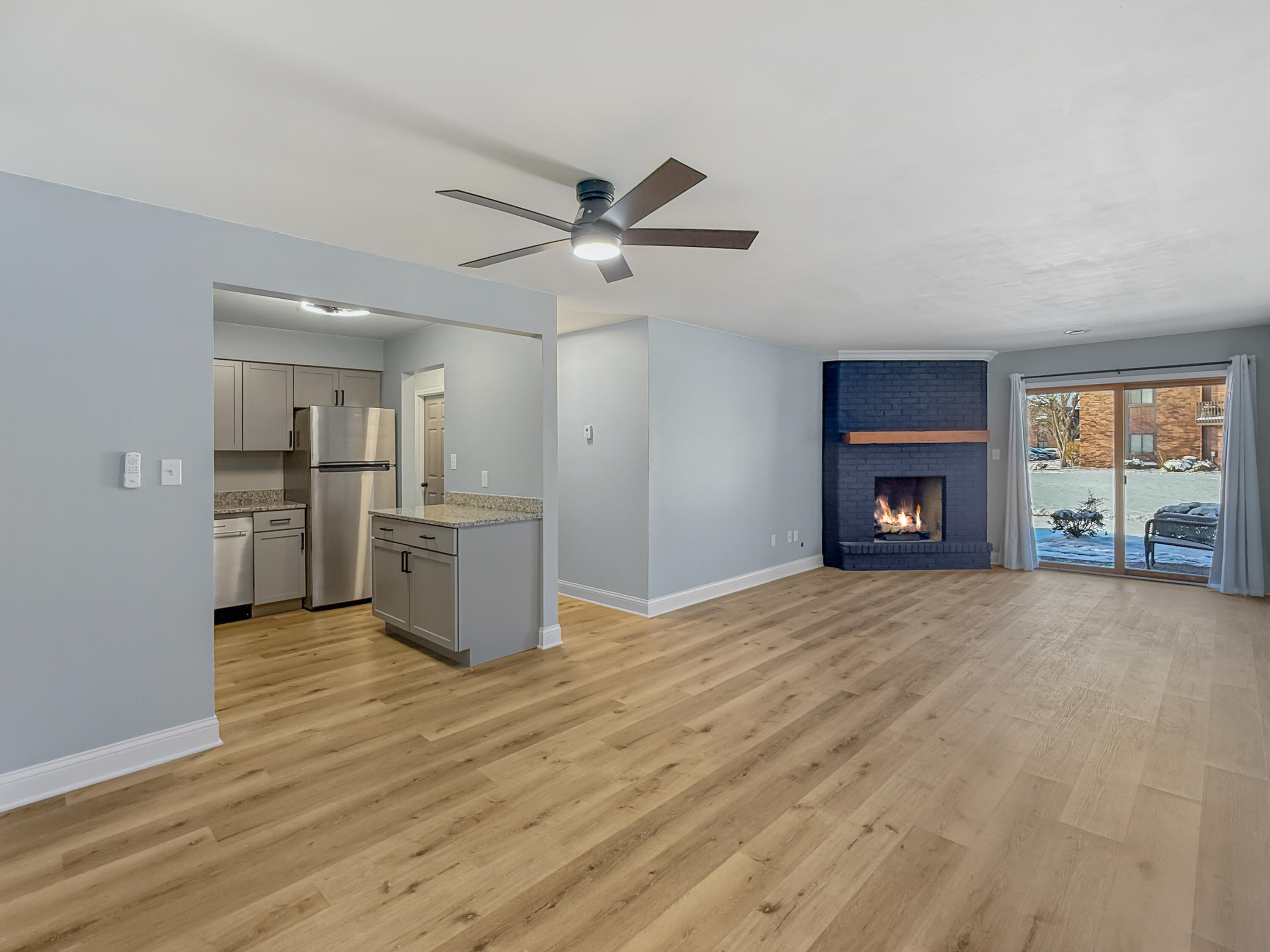 2049 45th Street, Unit 101 Highland, IN 46322 - Photo 2 of 13 a view of empty room with kitchen and fireplace