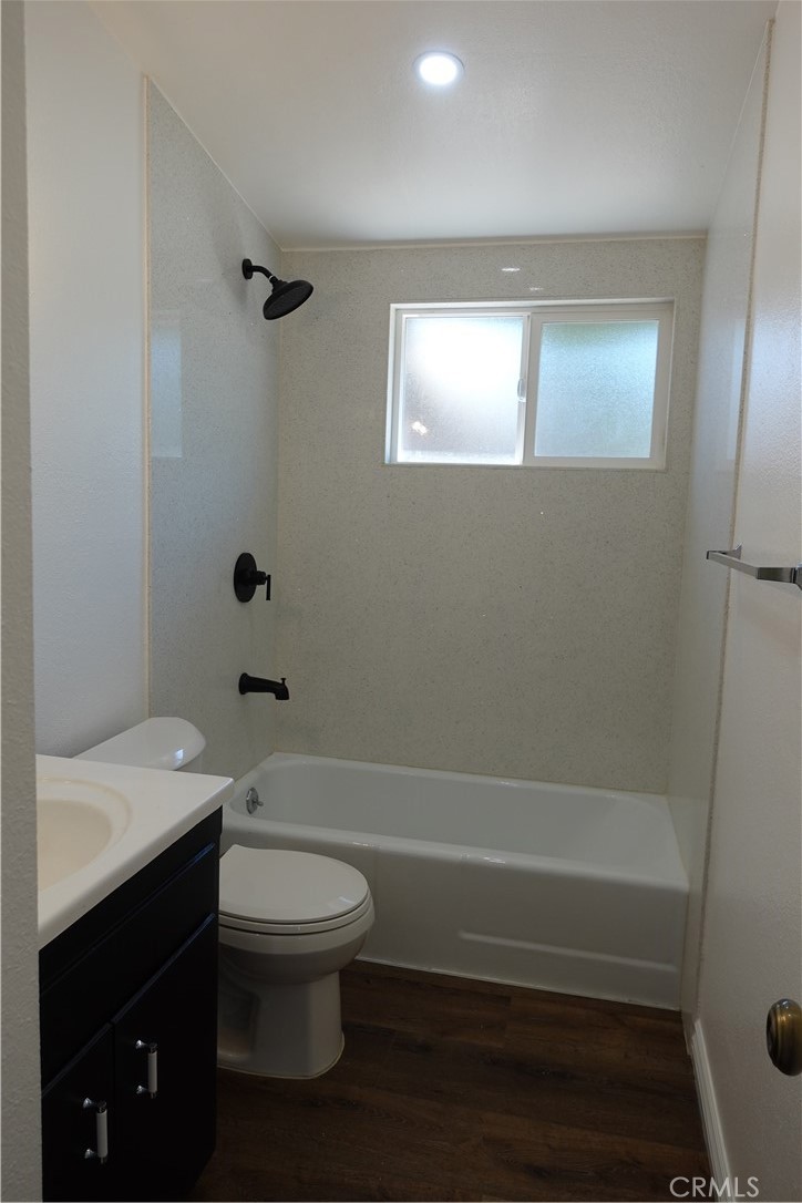38467 36th Street East Palmdale, CA 93550 - Photo 11 of 18 a bathroom with a toilet a sink and bathtub