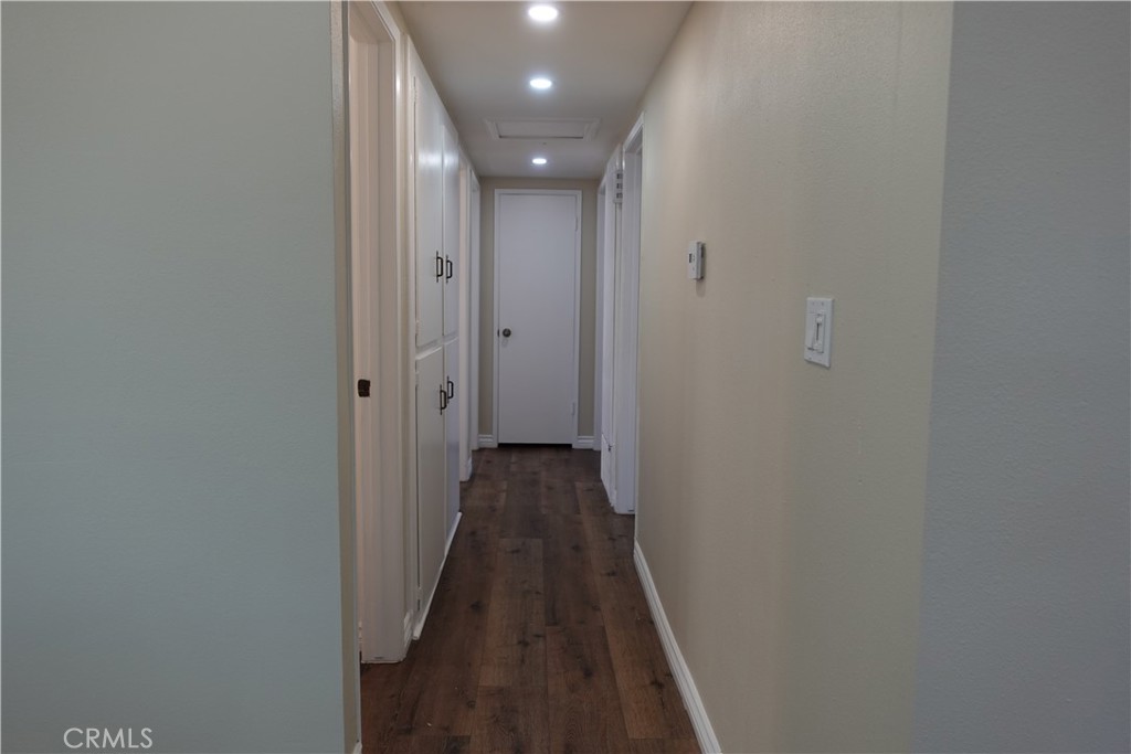 38467 36th Street East Palmdale, CA 93550 - Photo 8 of 18 a view of a hallway with wooden floor