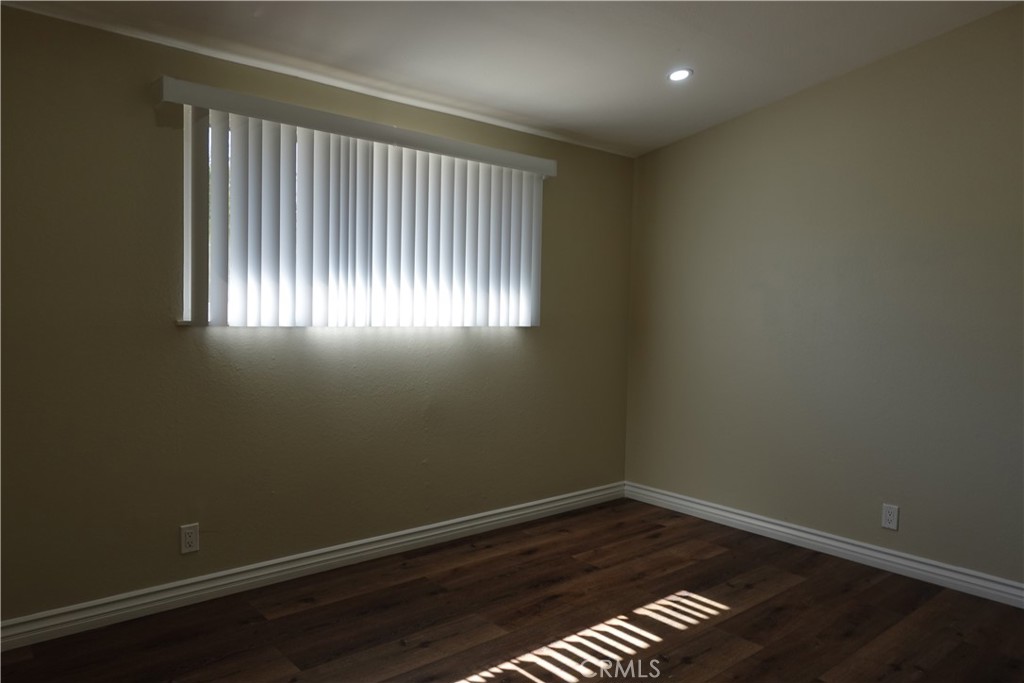 38467 36th Street East Palmdale, CA 93550 - Photo 10 of 18 an empty room with wooden floor and windows