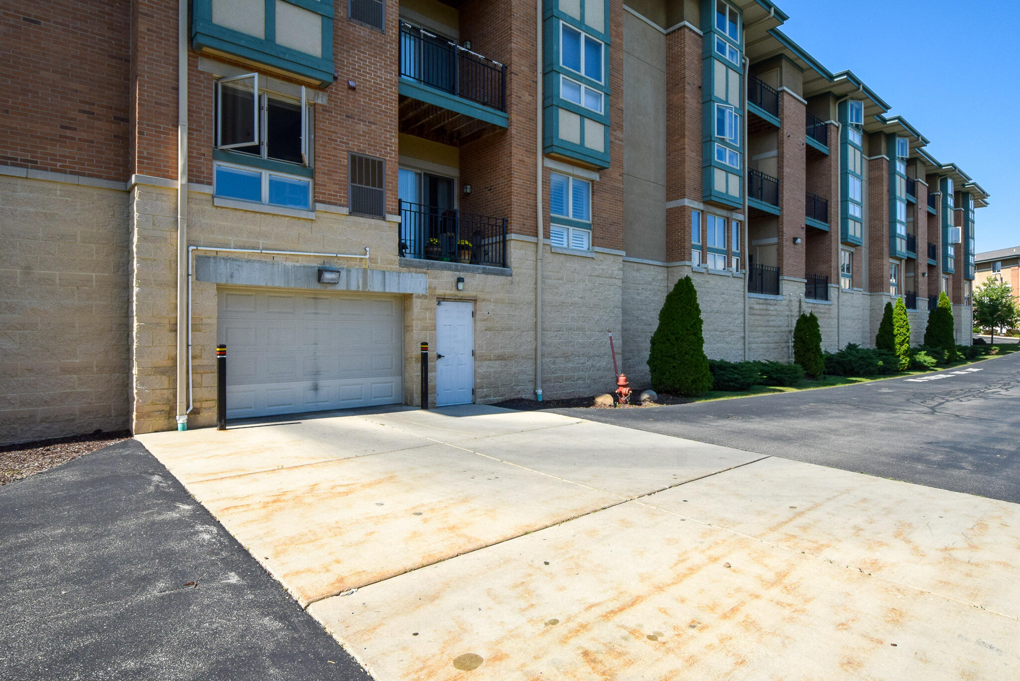 15295 West Library Lane, Unit 110 New Berlin, WI 53151 - Photo 23 of 35 garage entry to parking