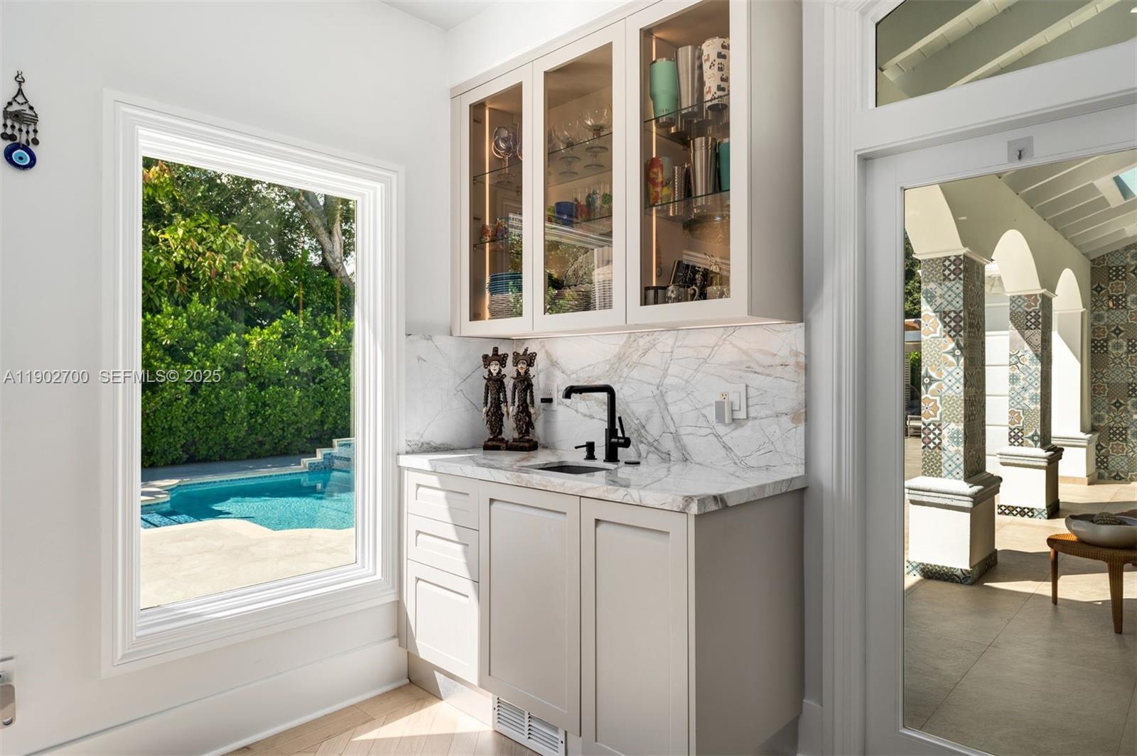 5770 Southwest 100th Street Pinecrest, FL 33156 - Photo 17 of 57 a kitchen with a sink and a window