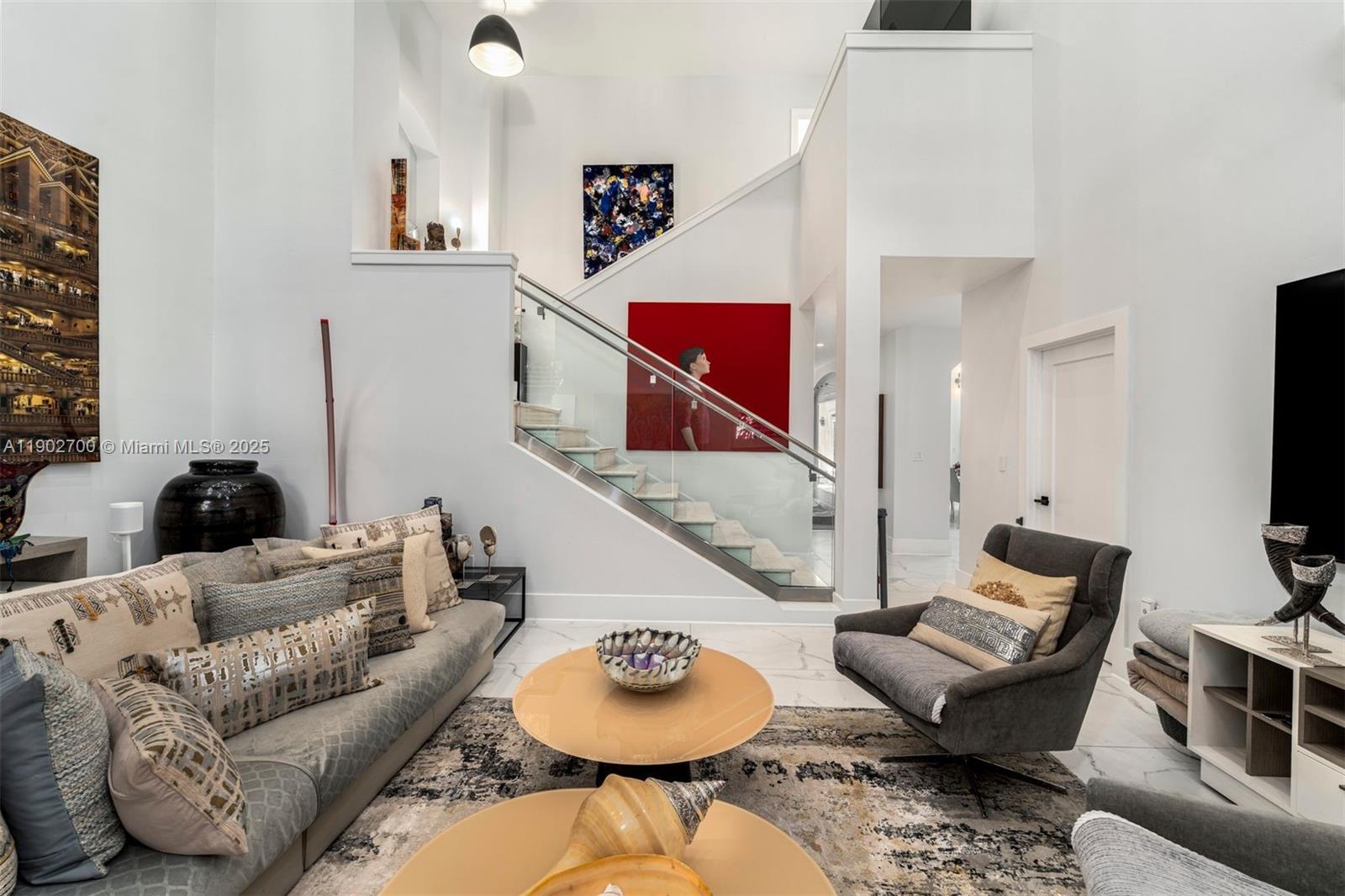 5770 Southwest 100th Street Pinecrest, FL 33156 - Photo 21 of 57 a living room with furniture and a flat screen tv