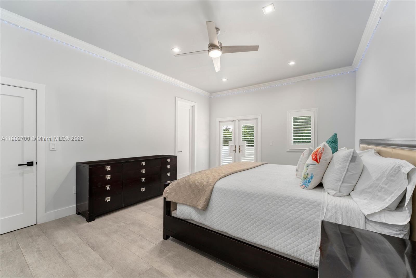 5770 Southwest 100th Street Pinecrest, FL 33156 - Photo 31 of 57 a bedroom with a bed and window