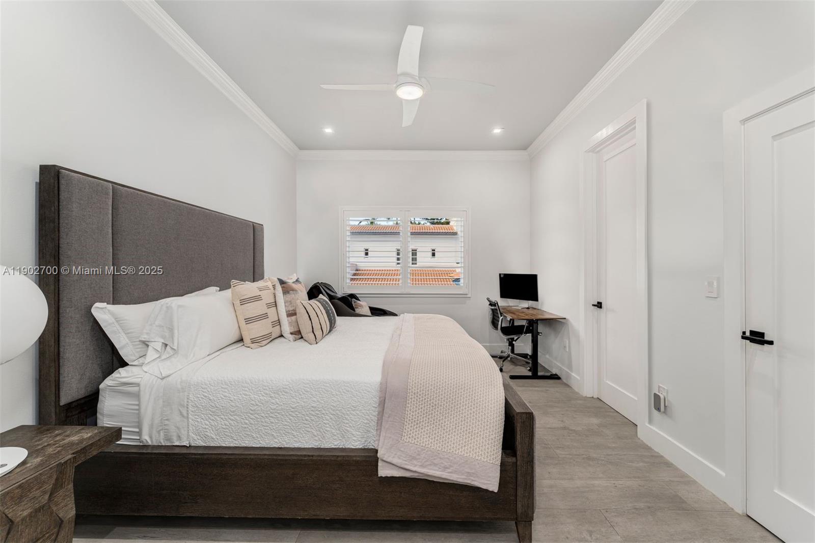 5770 Southwest 100th Street Pinecrest, FL 33156 - Photo 35 of 57 a bedroom with a bed and a chair