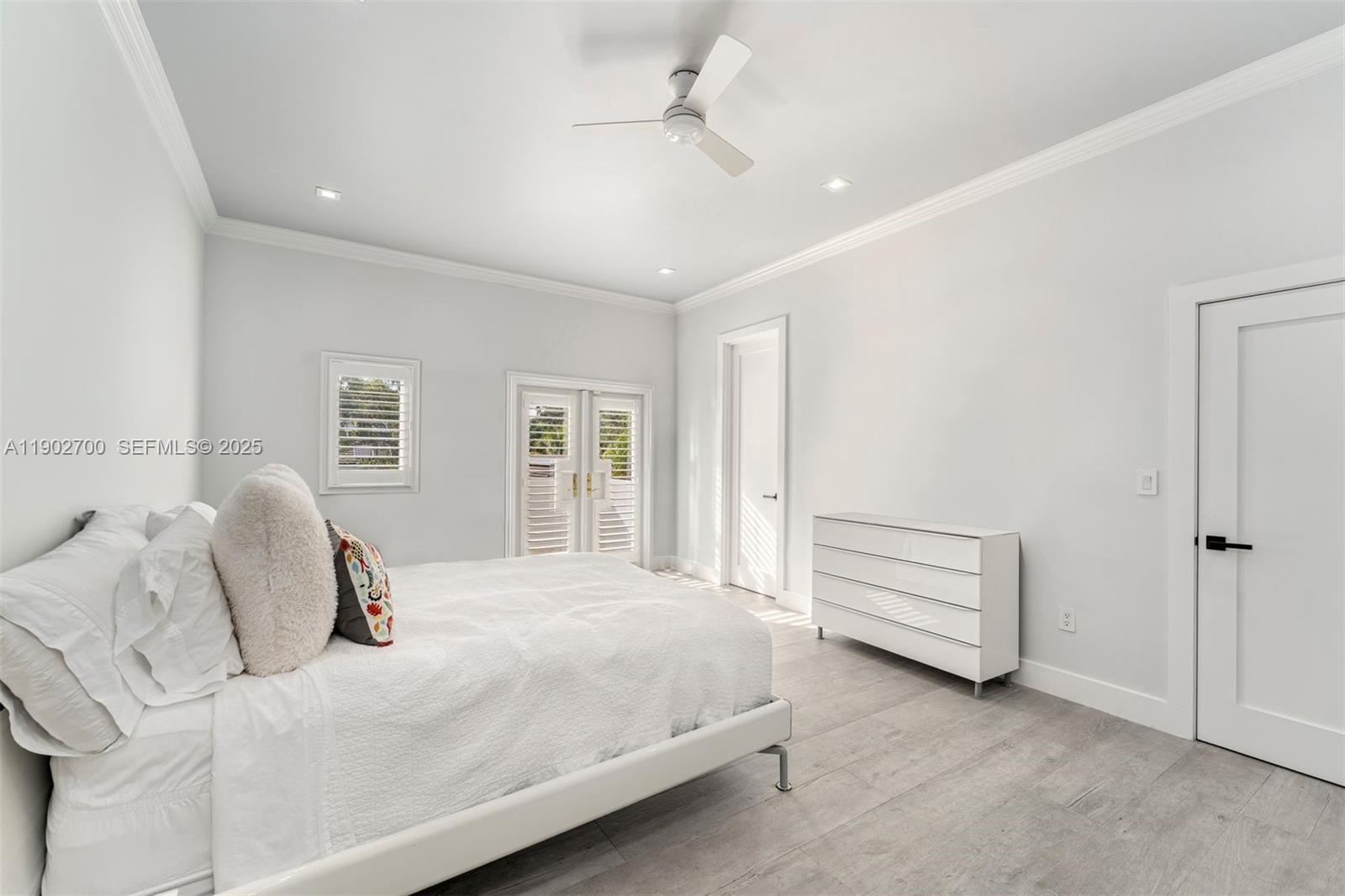 5770 Southwest 100th Street Pinecrest, FL 33156 - Photo 37 of 57 a bedroom with a bed and a window