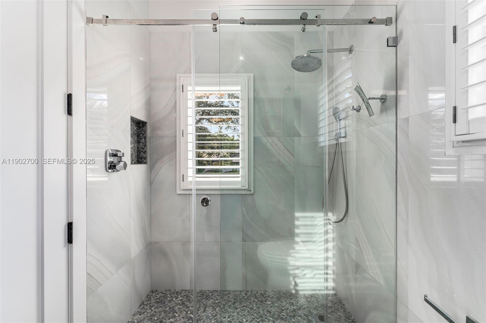 5770 Southwest 100th Street Pinecrest, FL 33156 - Photo 40 of 57 a bathroom with a shower