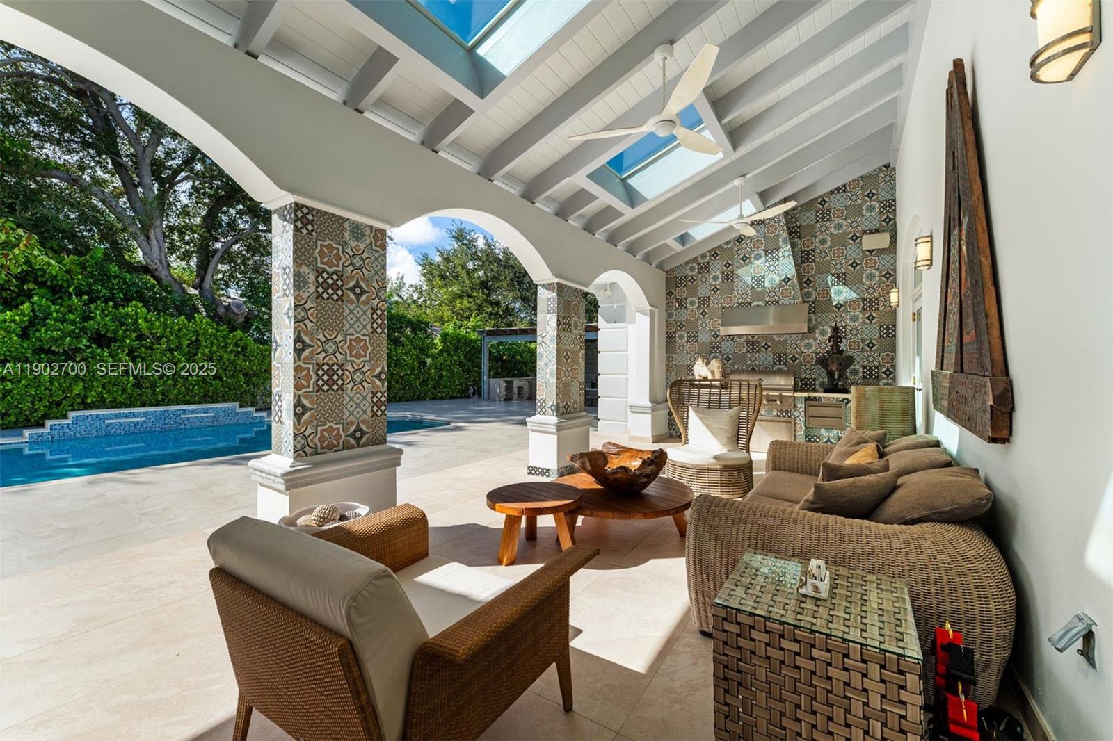 5770 Southwest 100th Street Pinecrest, FL 33156 - Photo 42 of 57 a outdoor space with patio the couches and a dining table with garden view