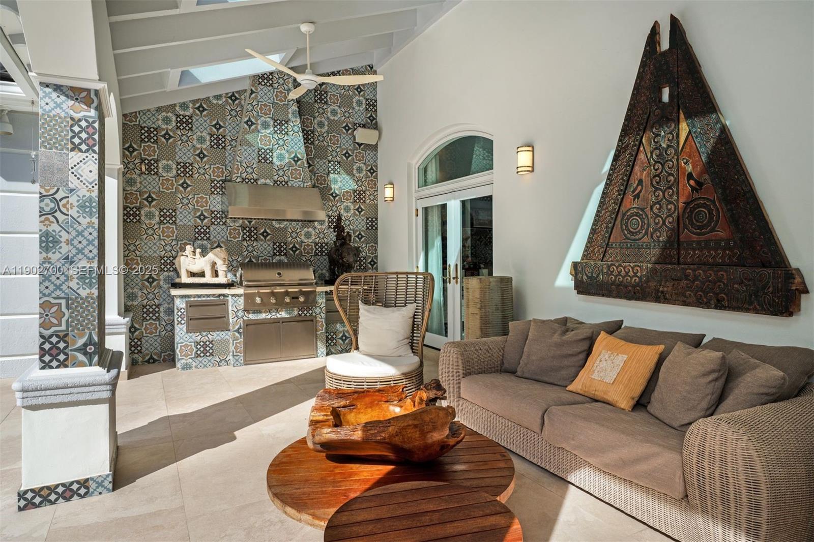 5770 Southwest 100th Street Pinecrest, FL 33156 - Photo 43 of 57 a living room with furniture and a floor to ceiling window