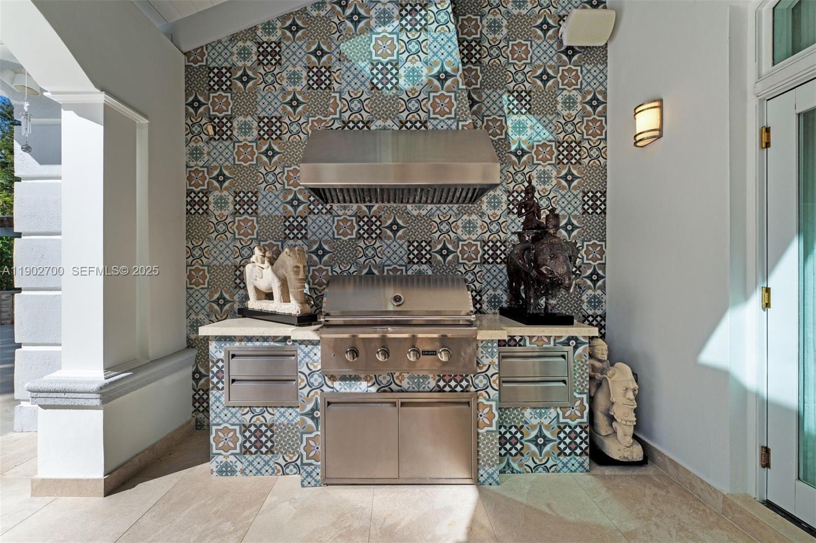 5770 Southwest 100th Street Pinecrest, FL 33156 - Photo 44 of 57 a stove top oven sitting inside of a kitchen