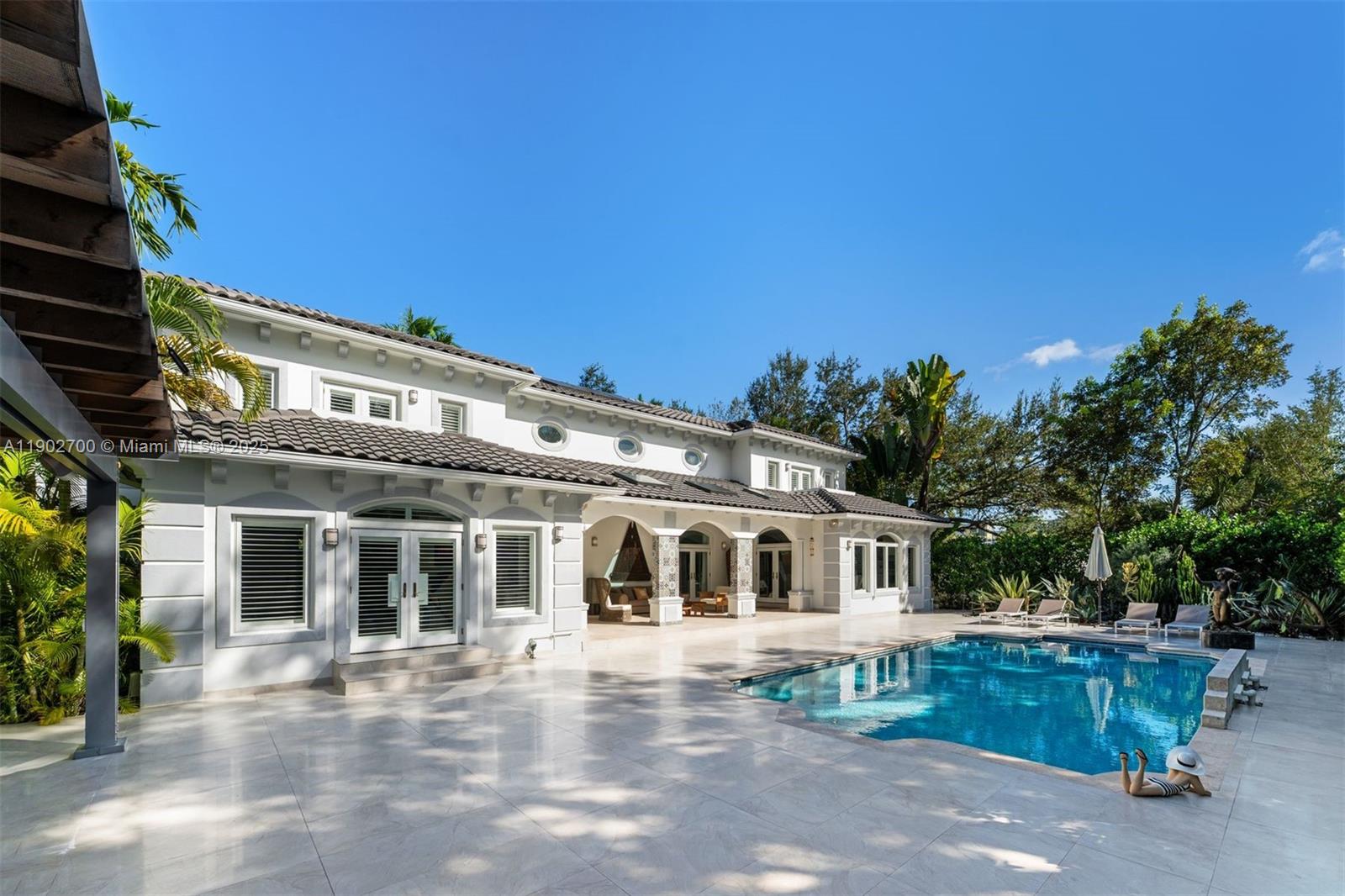 5770 Southwest 100th Street Pinecrest, FL 33156 - Photo 46 of 57 front view of a house with a porch