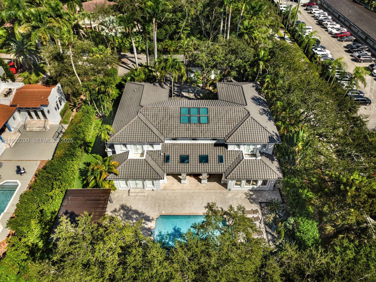 5770 Southwest 100th Street Pinecrest, FL 33156 - Photo 53 of 57 an aerial view of a house with a yard