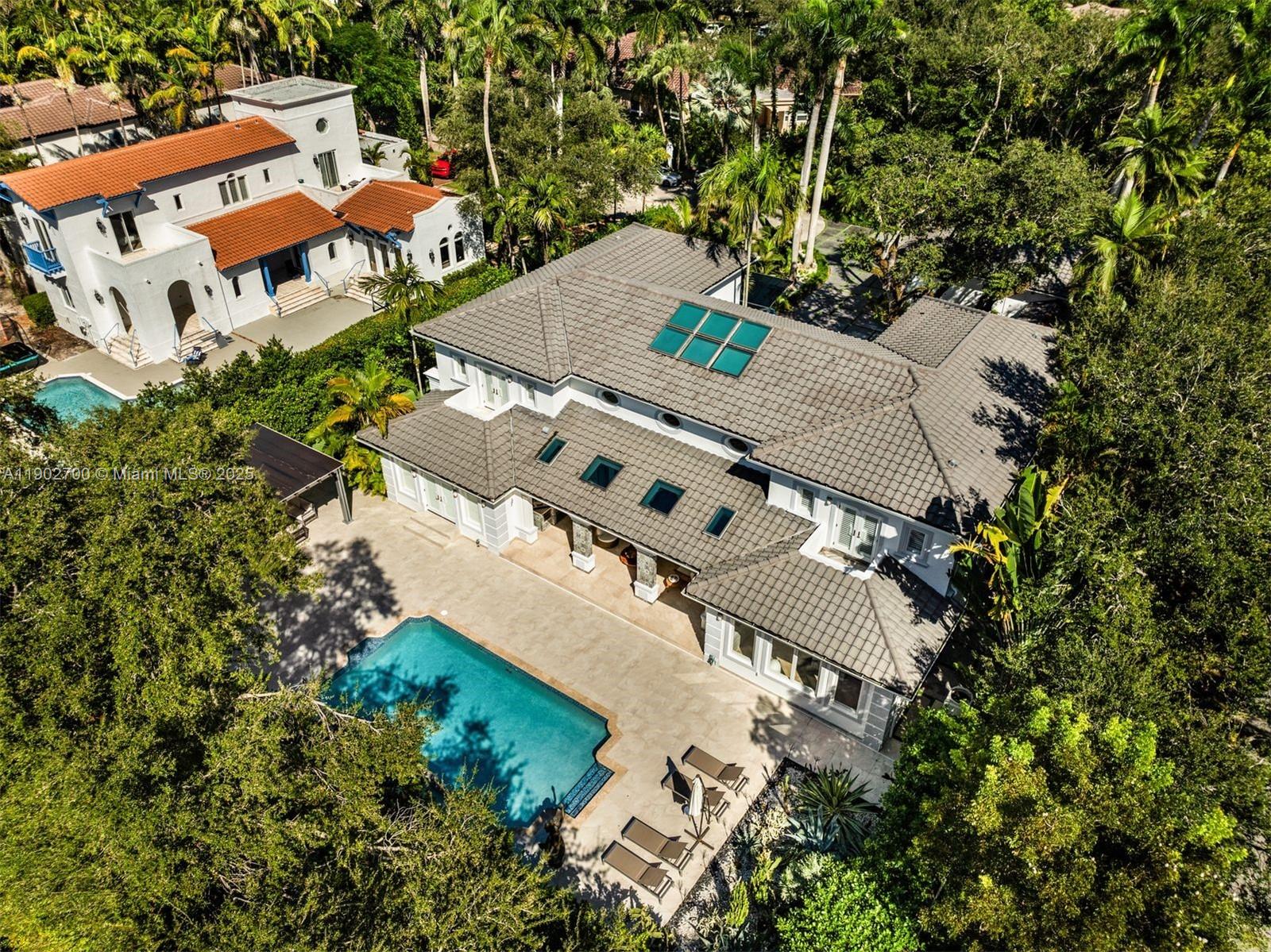 5770 Southwest 100th Street Pinecrest, FL 33156 - Photo 54 of 57 an aerial view of a house with a yard