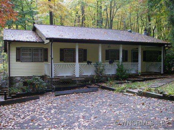 345 Reuben Branch Road Maggie Valley, NC 28751 - Photo 1 of 12 a front view of a house with garden