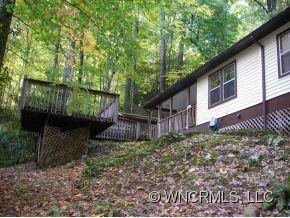 345 Reuben Branch Road Maggie Valley, NC 28751 - Photo 4 of 12 a backyard of a house with lots of green space