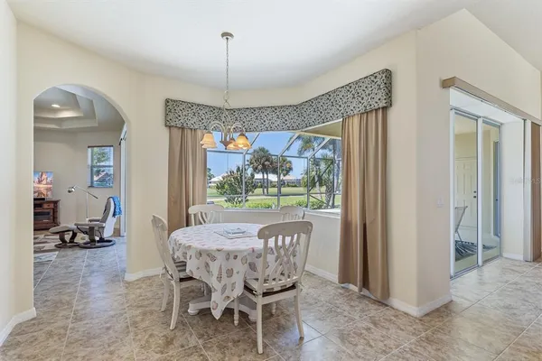 a view of a dining room with furniture window and outside view