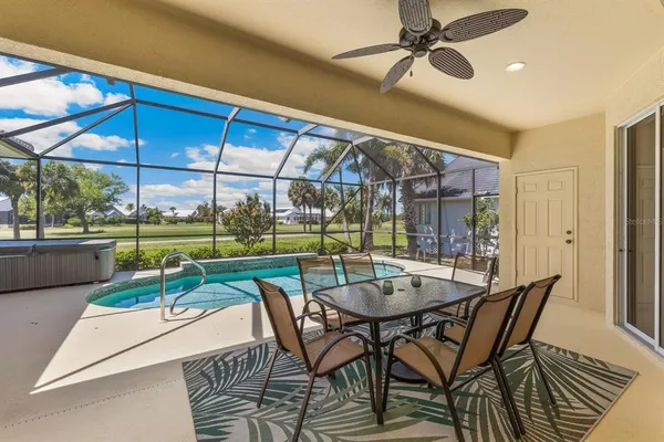 a dining area with furniture and outdoor view
