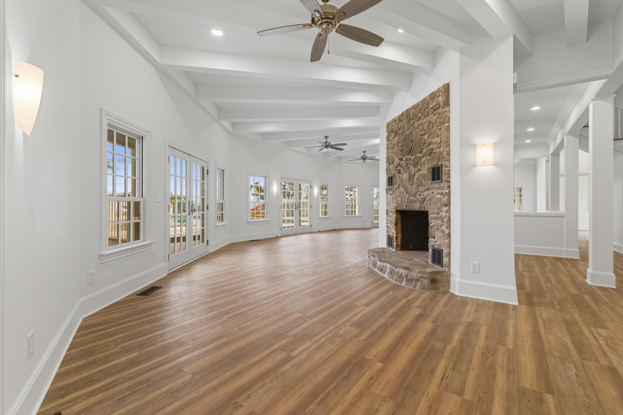 583 Bell Point Road Laceys Spring, AL 35754 - Photo 13 of 50 a view of empty room with wooden floor and fireplace