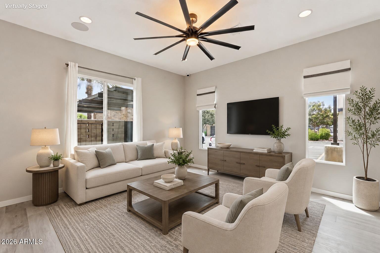 901 South Smith Road, Unit 1038 Tempe, AZ 85281 - Photo 11 of 29 a living room with furniture and a flat screen tv