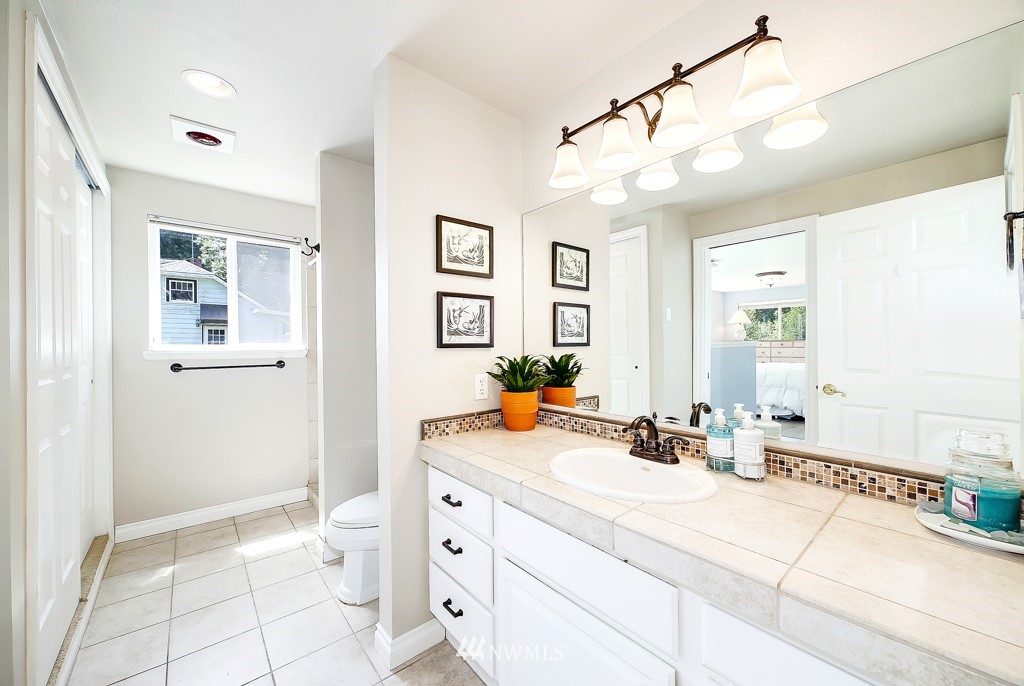 19637 Southeast 149th Street Renton, WA 98059 - Photo 12 of 29 a bathroom with a sink vanity and mirror