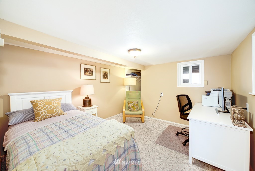 19637 Southeast 149th Street Renton, WA 98059 - Photo 13 of 29 a bedroom with a bed and a view of kitchen