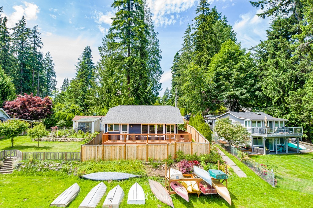 19637 Southeast 149th Street Renton, WA 98059 - Photo 18 of 29 a front view of a house with a yard table and chairs