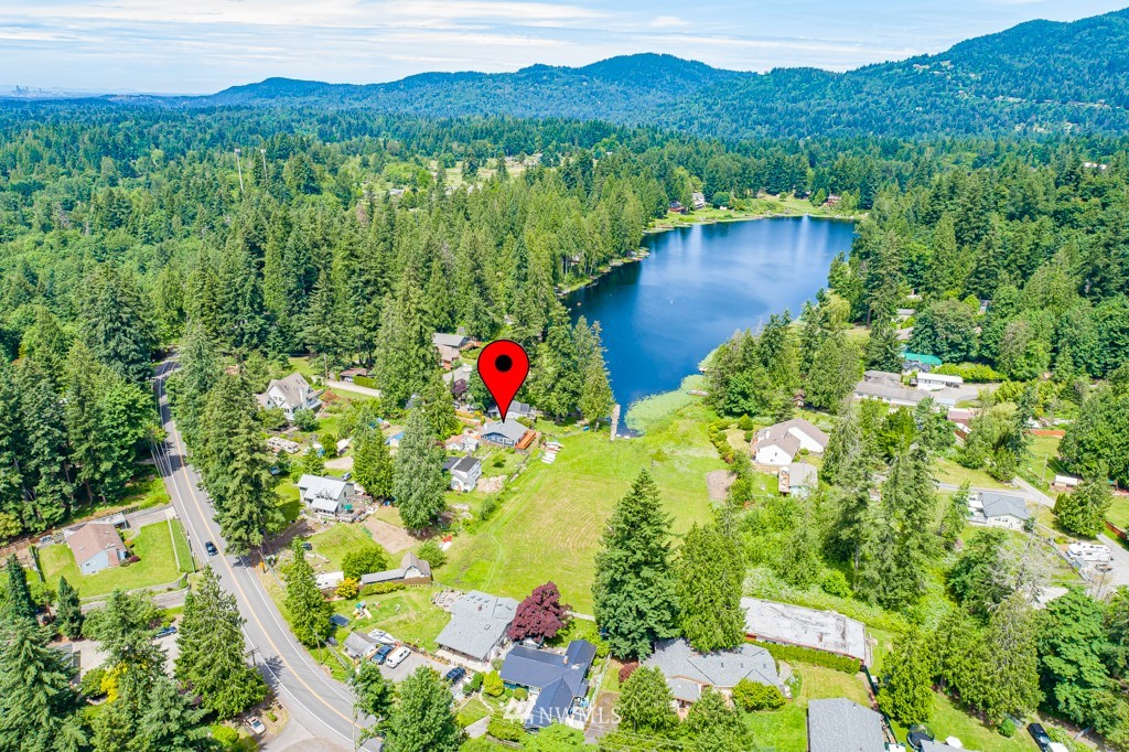 19637 Southeast 149th Street Renton, WA 98059 - Photo 24 of 29 a view of a lush green hillside and a house