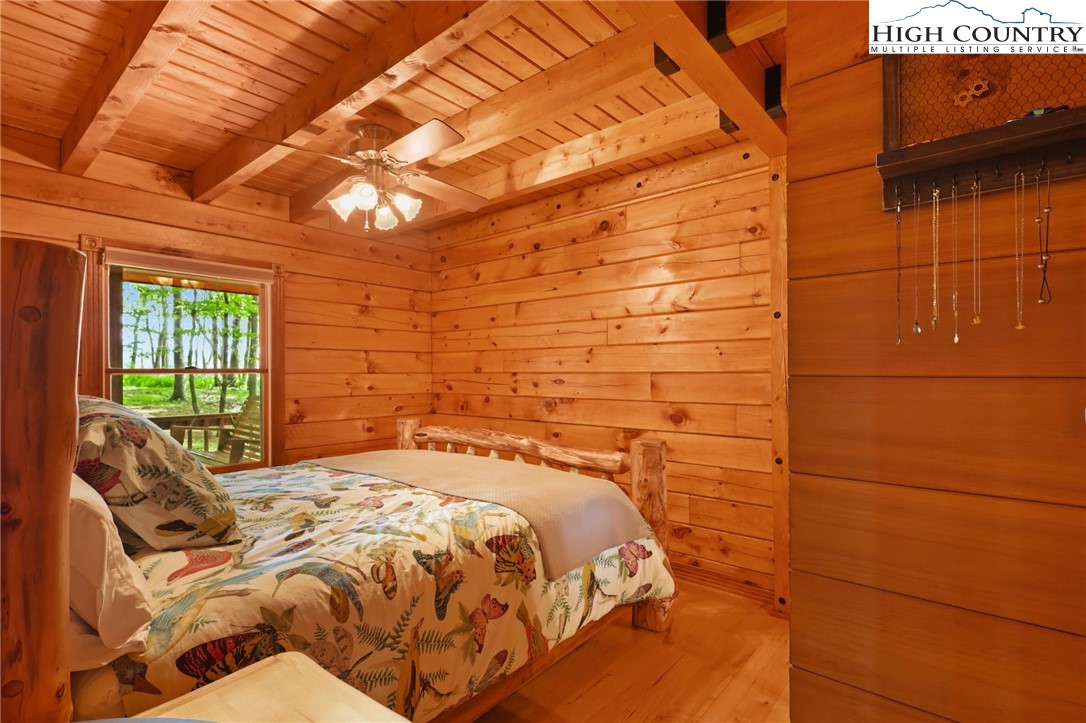 151 Cascade Drive Purlear, NC 28665 - Photo 14 of 46 a bed sitting in a bedroom next to a window