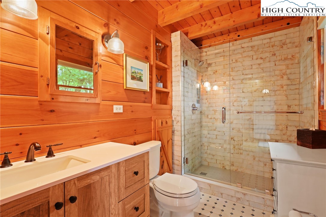 151 Cascade Drive Purlear, NC 28665 - Photo 16 of 46 a bathroom with a sink a toilet and shower