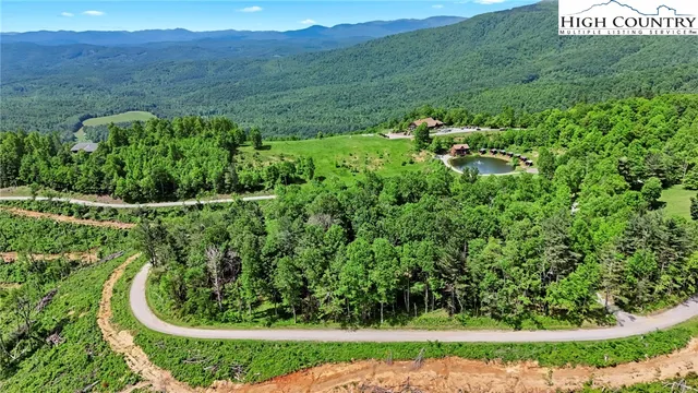 a view of a garden with a building
