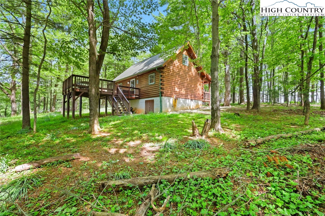 151 Cascade Drive Purlear, NC 28665 - Photo 29 of 46 a view of a house with backyard