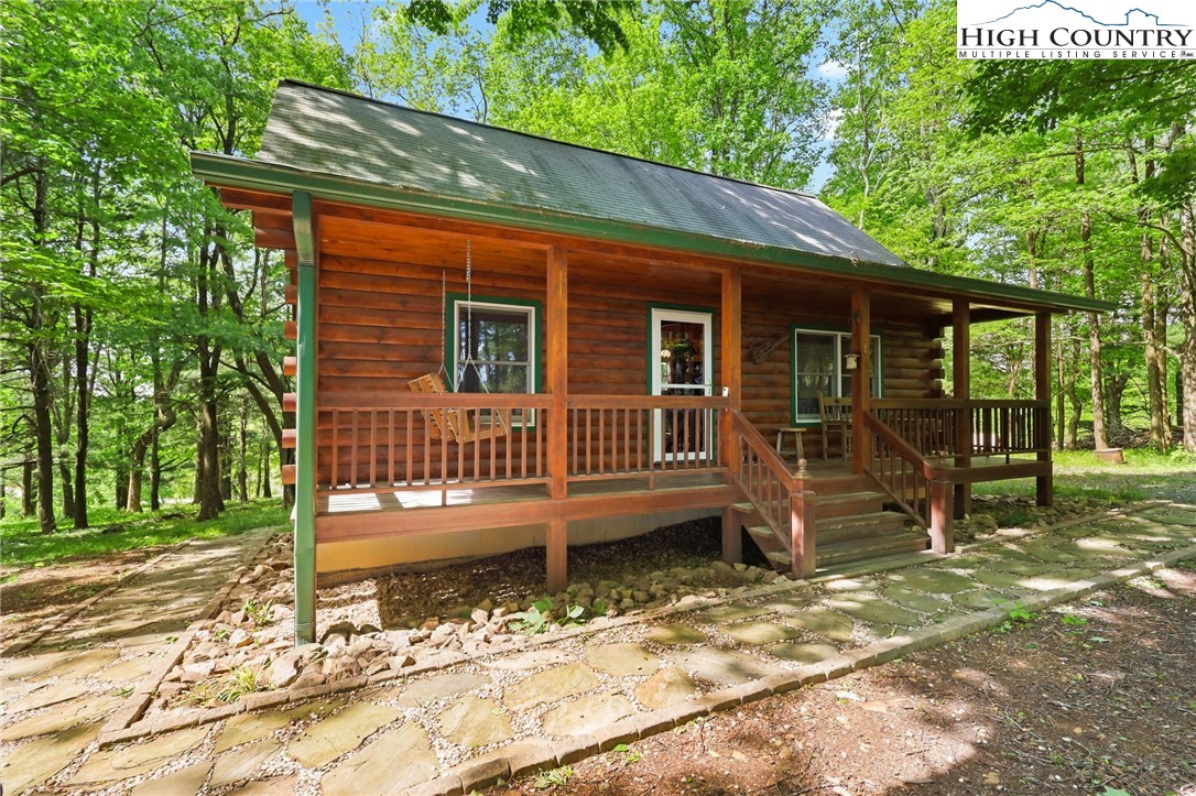 151 Cascade Drive Purlear, NC 28665 - Photo 35 of 46 a view of a house with a yard and wooden fence