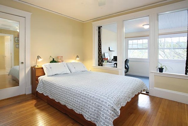 145 University Road, Unit 2 Brookline, MA 02445 - Photo 5 of 7 a bedroom with bed and a large window