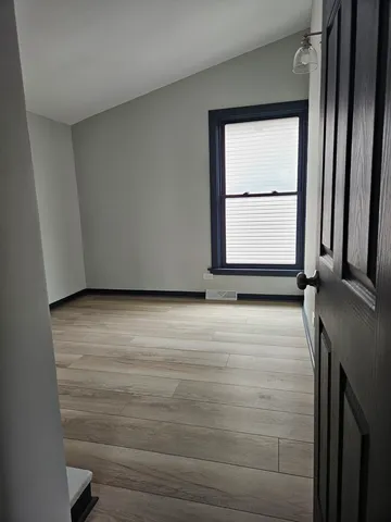 a view of an empty room with a window