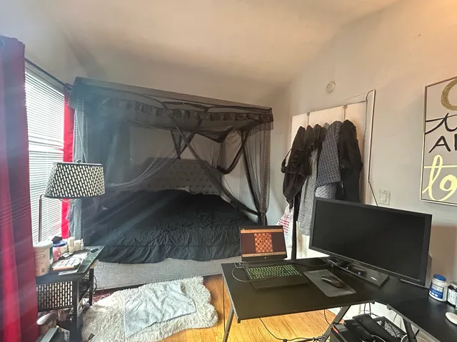 a living room with furniture and a lamp