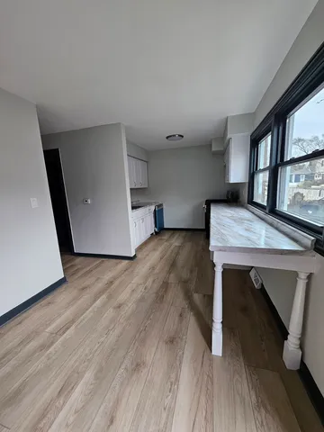 a room with furniture and a wooden floor