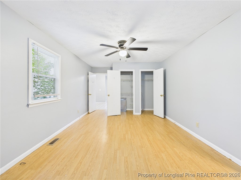 1540 Mack Street Spring Lake, NC 28390 - Photo 14 of 31 a big room with closet and a ceiling fan