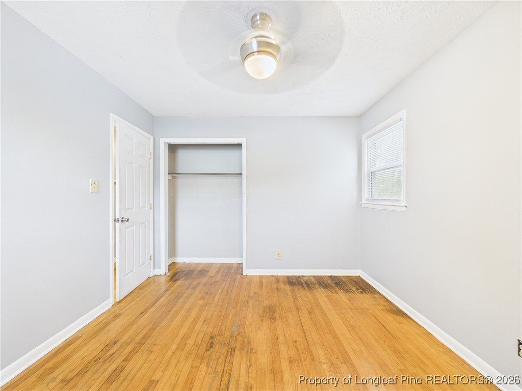 1540 Mack Street Spring Lake, NC 28390 - Photo 26 of 31 a view of a room with wooden floor and white walls
