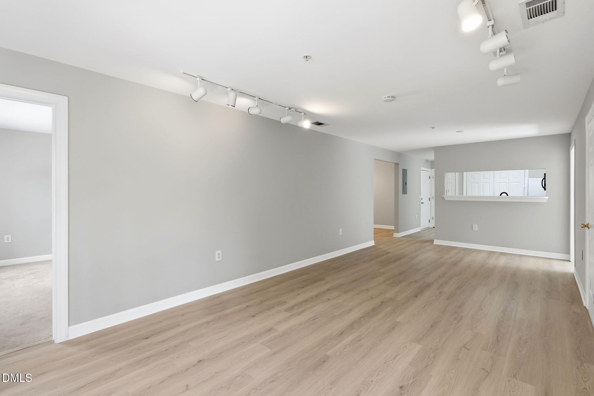 929 Morreene Road, Unit A23 Durham, NC 27705 - Photo 8 of 41 wooden floor in an empty room with a window