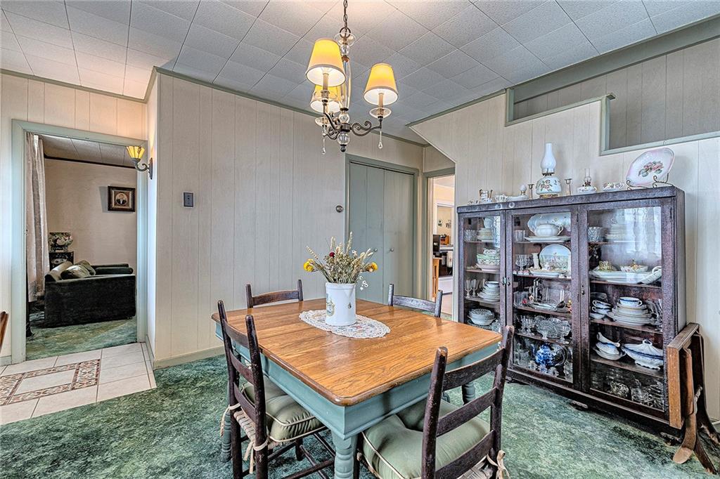 11189 Old Trail Road Irwin, PA 15642 - Photo 11 of 22 a dining room with furniture and wooden floor