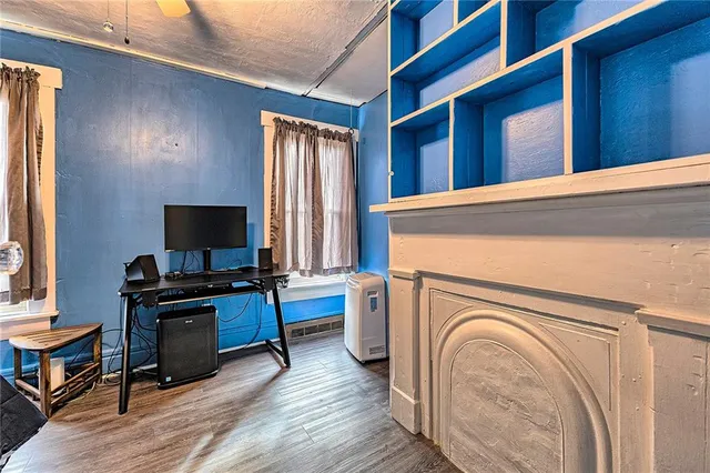 a view of a livingroom with furniture and a flat screen tv