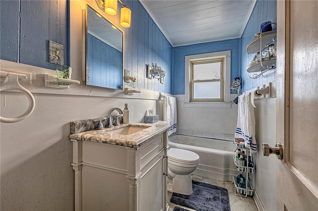11189 Old Trail Road Irwin, PA 15642 - Photo 16 of 22 a bathroom with a granite countertop toilet sink and mirror