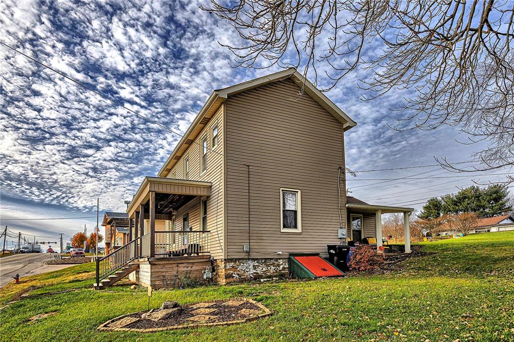 11189 Old Trail Road Irwin, PA 15642 - Photo 3 of 22 a front view of a house with a yard