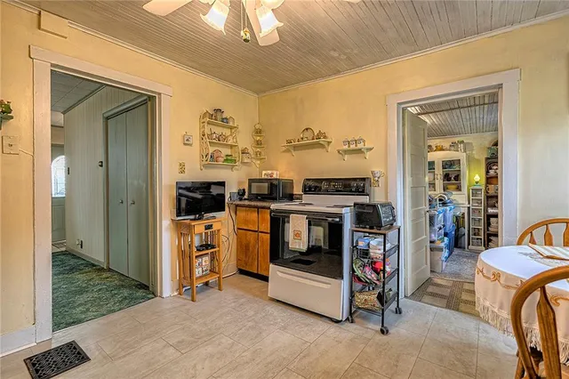 a kitchen with stainless steel appliances granite countertop a stove and a refrigerator