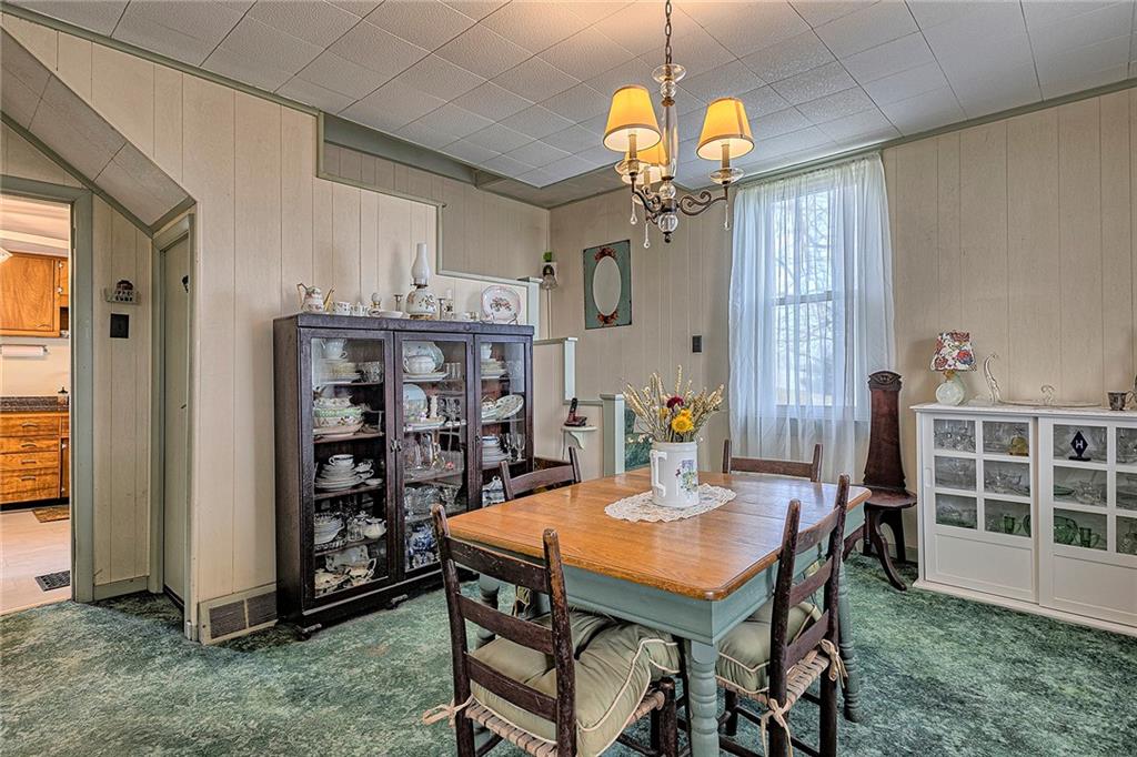 11189 Old Trail Road Irwin, PA 15642 - Photo 10 of 22 a view of a dining room with furniture and chandelier